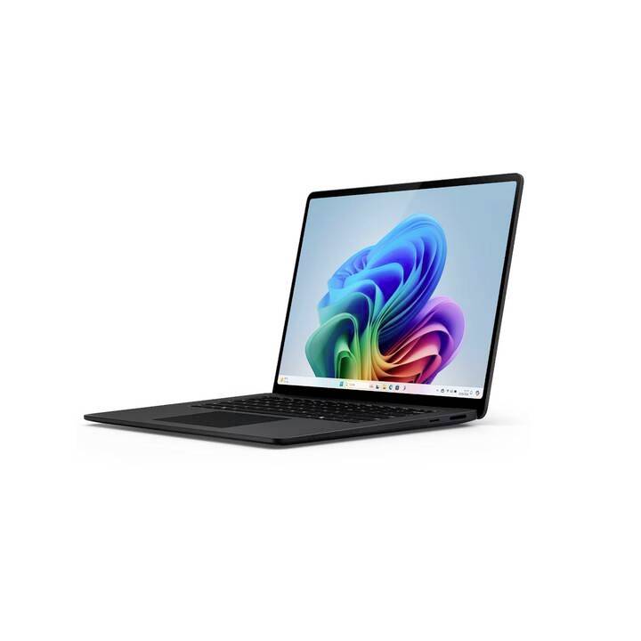 Ein schwarzer Laptop mit Regenbogen-Bildschirmhintergrund, das Gerät steht leicht nach rechts geneigt auf einer weißen Fläche.