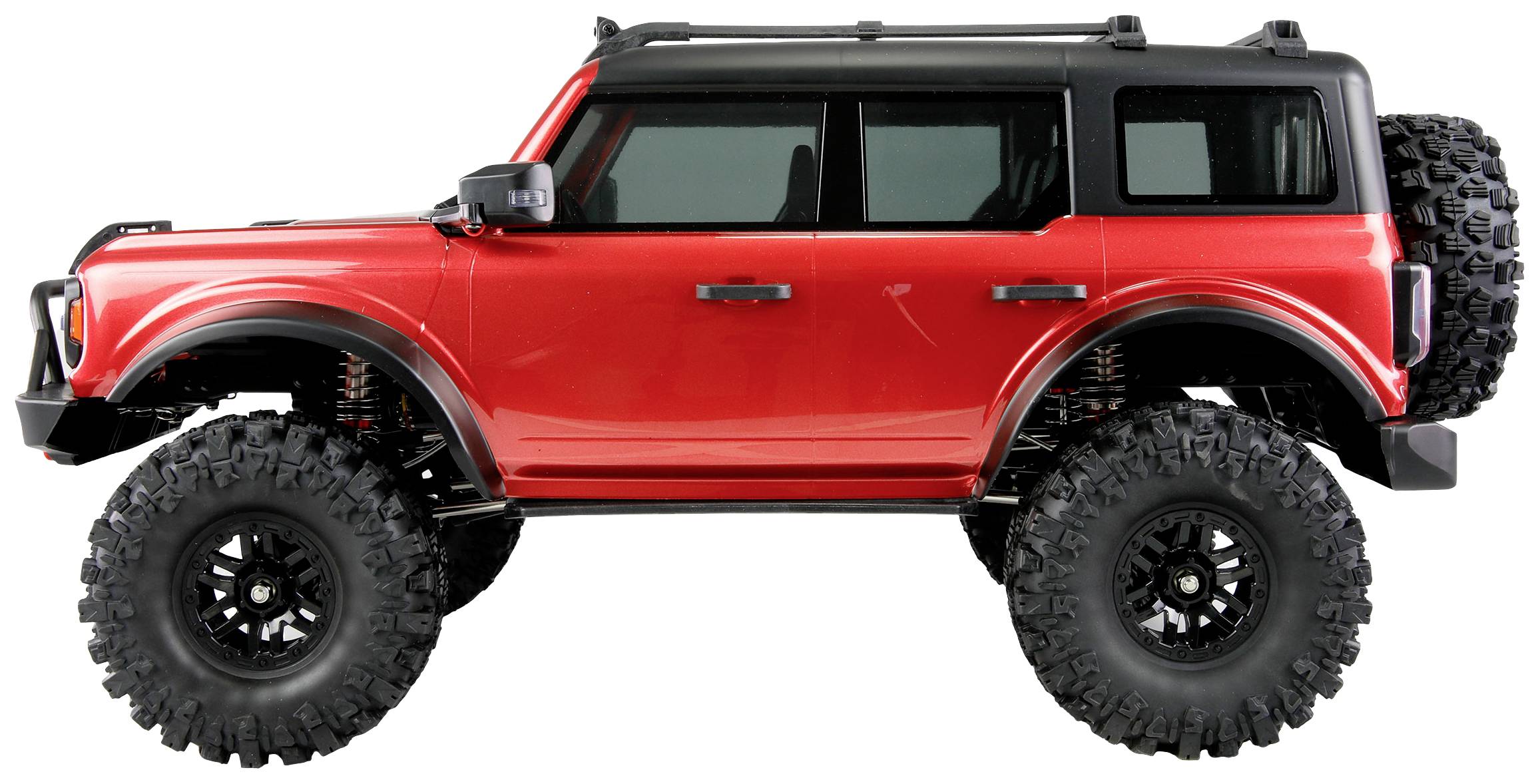 Ein rotes Modellauto mit großen, robusten Reifen und schwarzen Fenstern, das einem Geländewagen ähnelt. Es hat eine Ersatzreifenhalterung hinten.