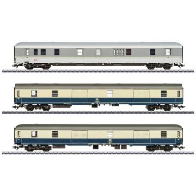 Zugmodell mit drei verschiedenen Waggons auf Gleisen, jeweils in Blau- und Beigetönen. Oben grauer Waggon, unten zwei ähnliche im Design.