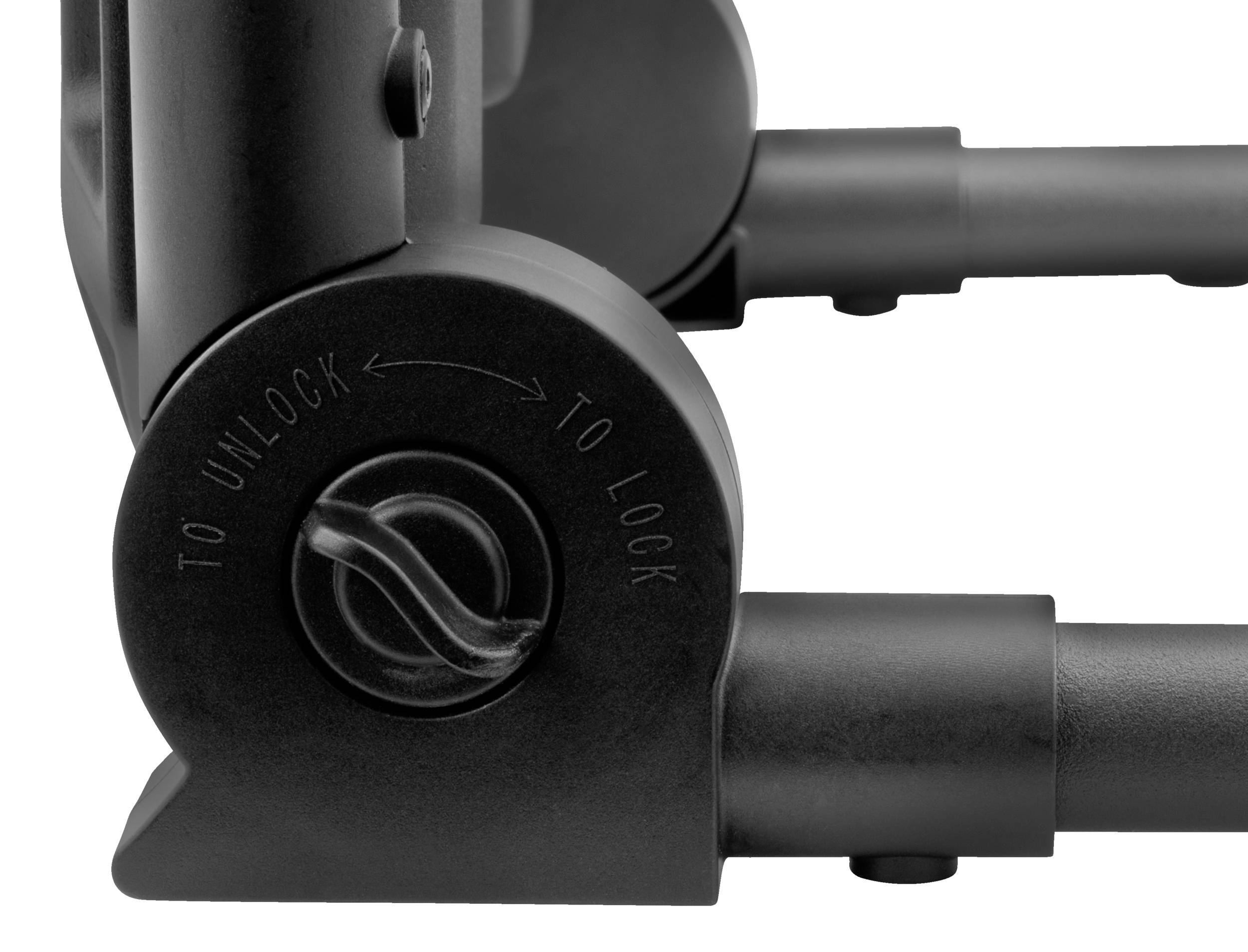 Nahaufnahme eines schwarzen Verriegelungsmechanismus mit Aufschrift 'To unlock' und 'To lock'. Zeigt Funktion eines Schließsystems.