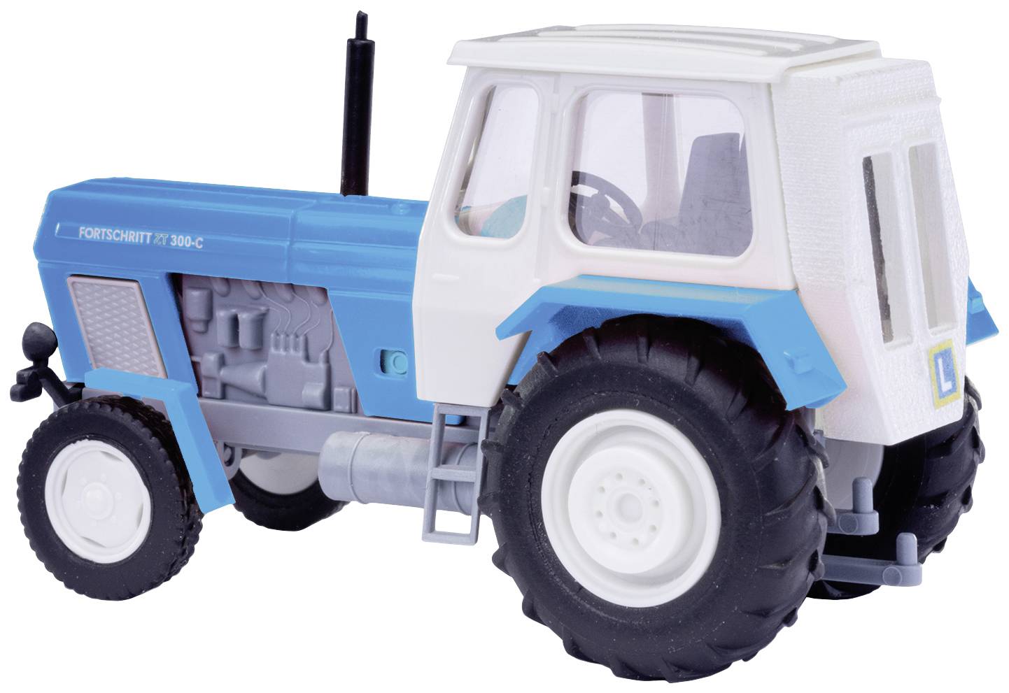 Ein blau-weißer Spielzeugtraktor mit der Aufschrift 'FORTSCHRITT ZT 300-C' auf der Seite, möglicherweise ein Modellfahrzeug.