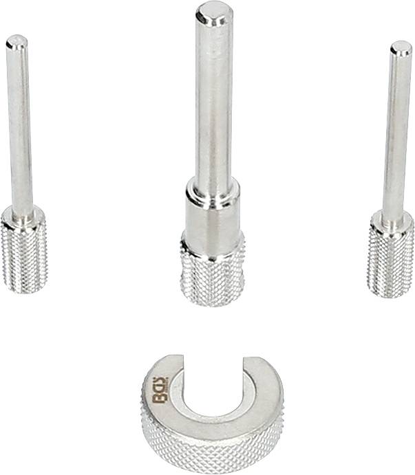 Drei zylindrische Metallwerkzeuge und eine U-förmige Halterung mit geriffelten Griffen, vor weißem Hintergrund.