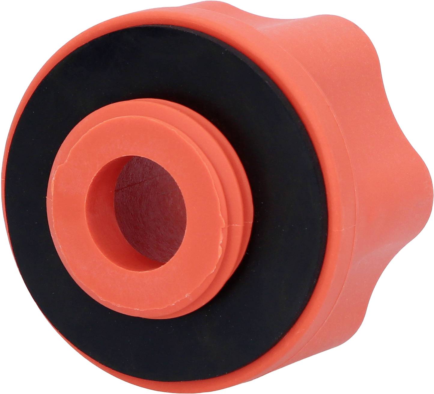 Ein roter, zylinderförmiger Gegenstand mit einem schwarzen Ring in der Mitte, möglicherweise ein Teil eines mechanischen Systems.