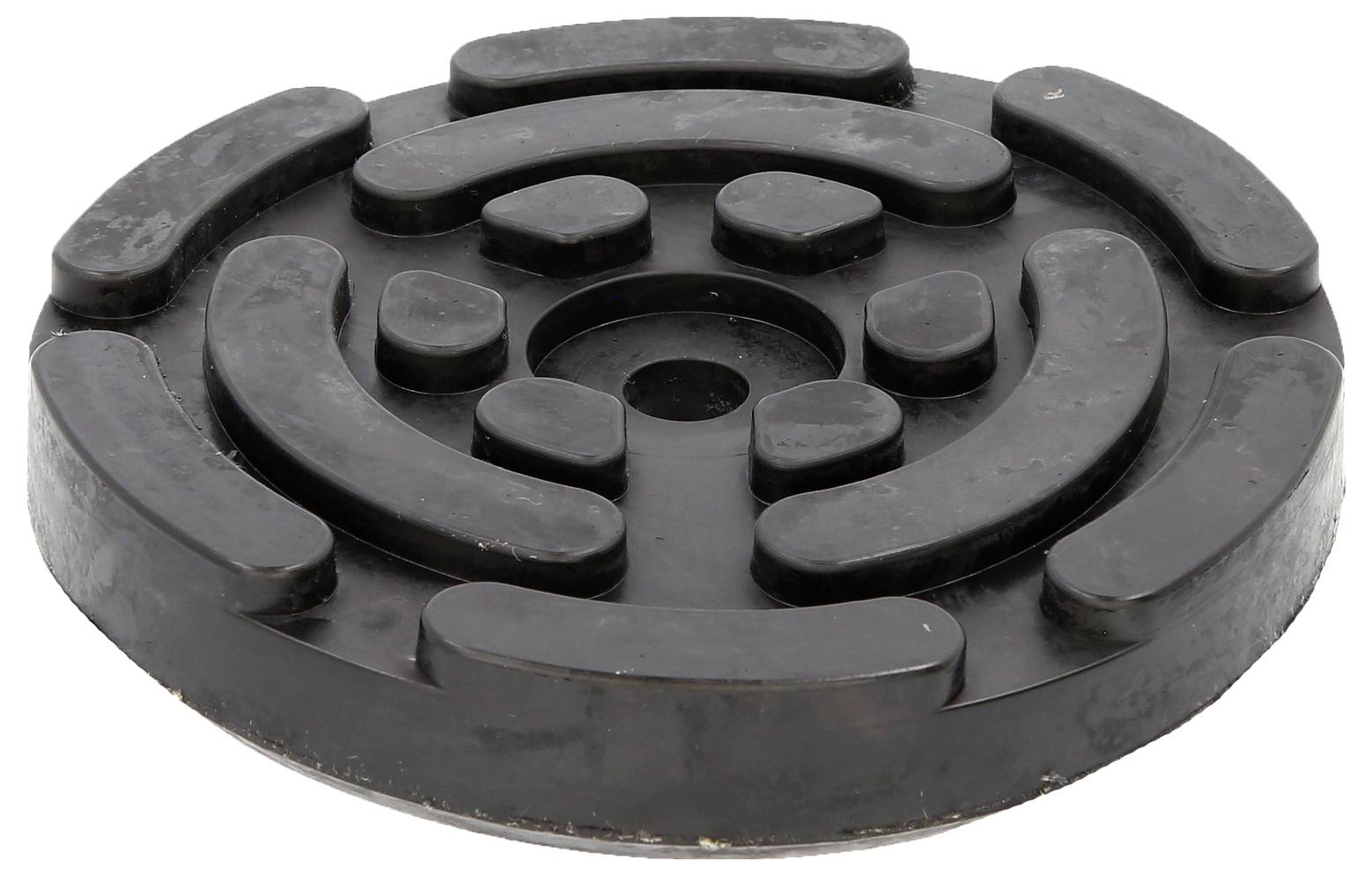 Eine schwarze, runde Gummimatte mit einem labyrinthartigen Muster auf der Oberfläche.