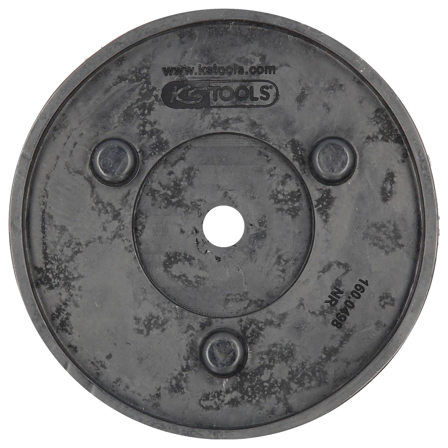 Eine schwarze Metallplatte mit der Aufschrift 'ks tools'. Sie hat eine zentrale Bohrung und drei symmetrisch angeordnete Vertiefungen.