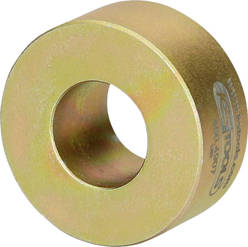 Ein metallischer Ring in goldener Farbe mit einem glatten, runden Loch in der Mitte. Auf der Seitenfläche sind Markierungen zu erkennen.