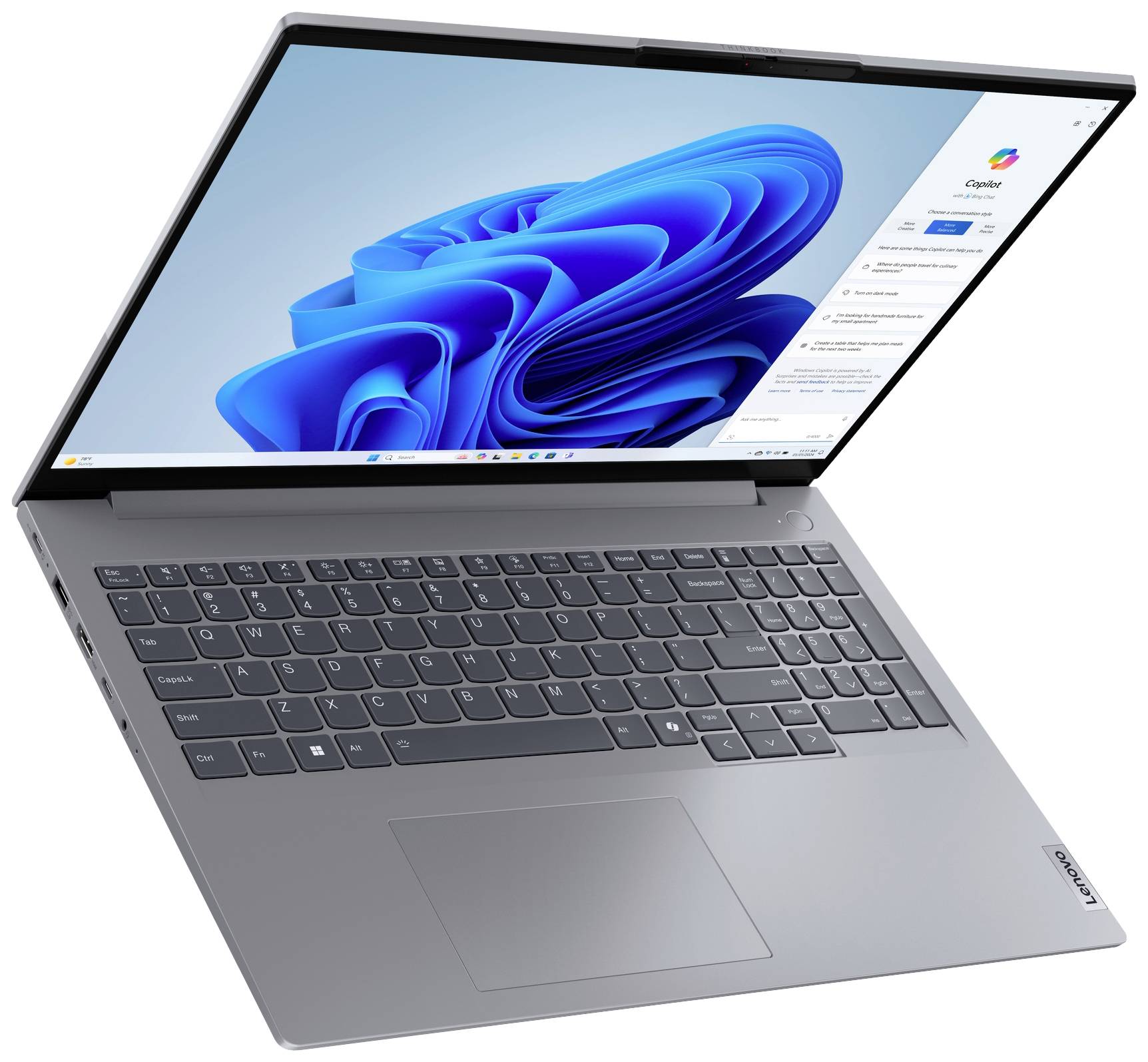 Ein moderner Laptop mit einem geöffneten Display, das eine Windows-Oberfläche mit einem blauen Hintergrund zeigt.