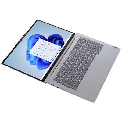 Ein grauer Laptop mit Windows-Oberfläche, Tastatur sichtbar. Der Bildschirm zeigt das Windows-Startmenü und blaue Designs.