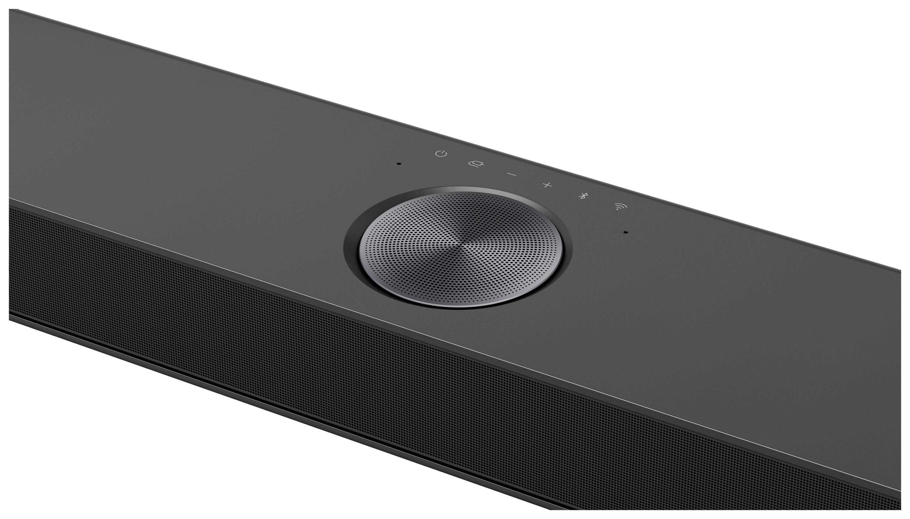 Schwarze Soundbar mit kreisförmigem Lautstärkeregler und drei Bedientasten auf der Oberseite. Moderner, eleganter Look.