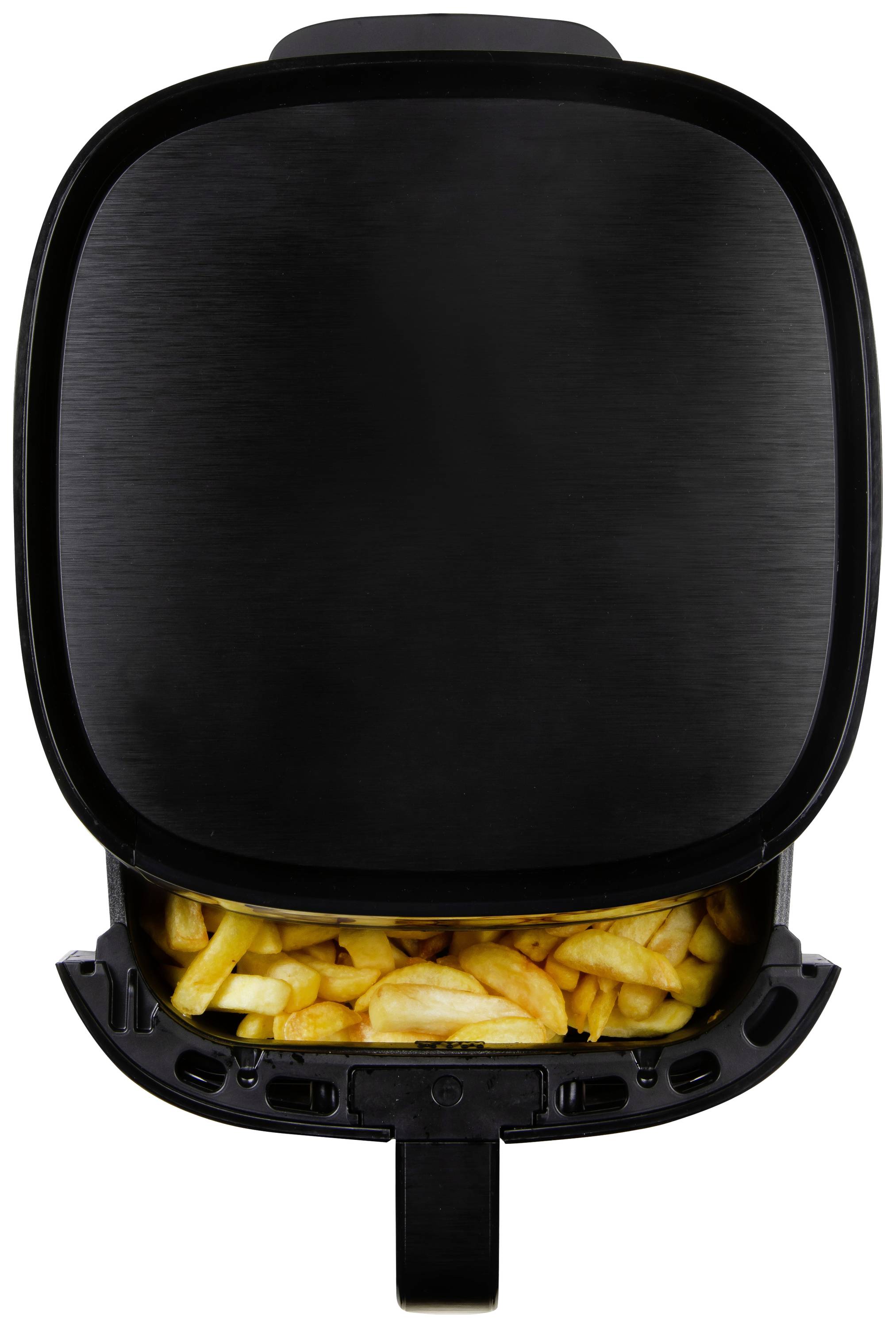 'Schwarzer Mini-Backofen mit geöffnetem Fach, gefüllt mit knusprigen Pommes frites. Obere Ansicht der Küchengeräts.'