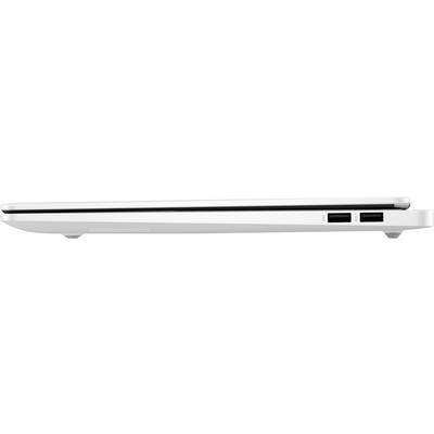 Ein geschlossenes, weißes Laptop von der Seite, auf einem Tisch. Links eine leicht gebogene Basis, rechts Anschlüsse und Lüftungsschlitze.