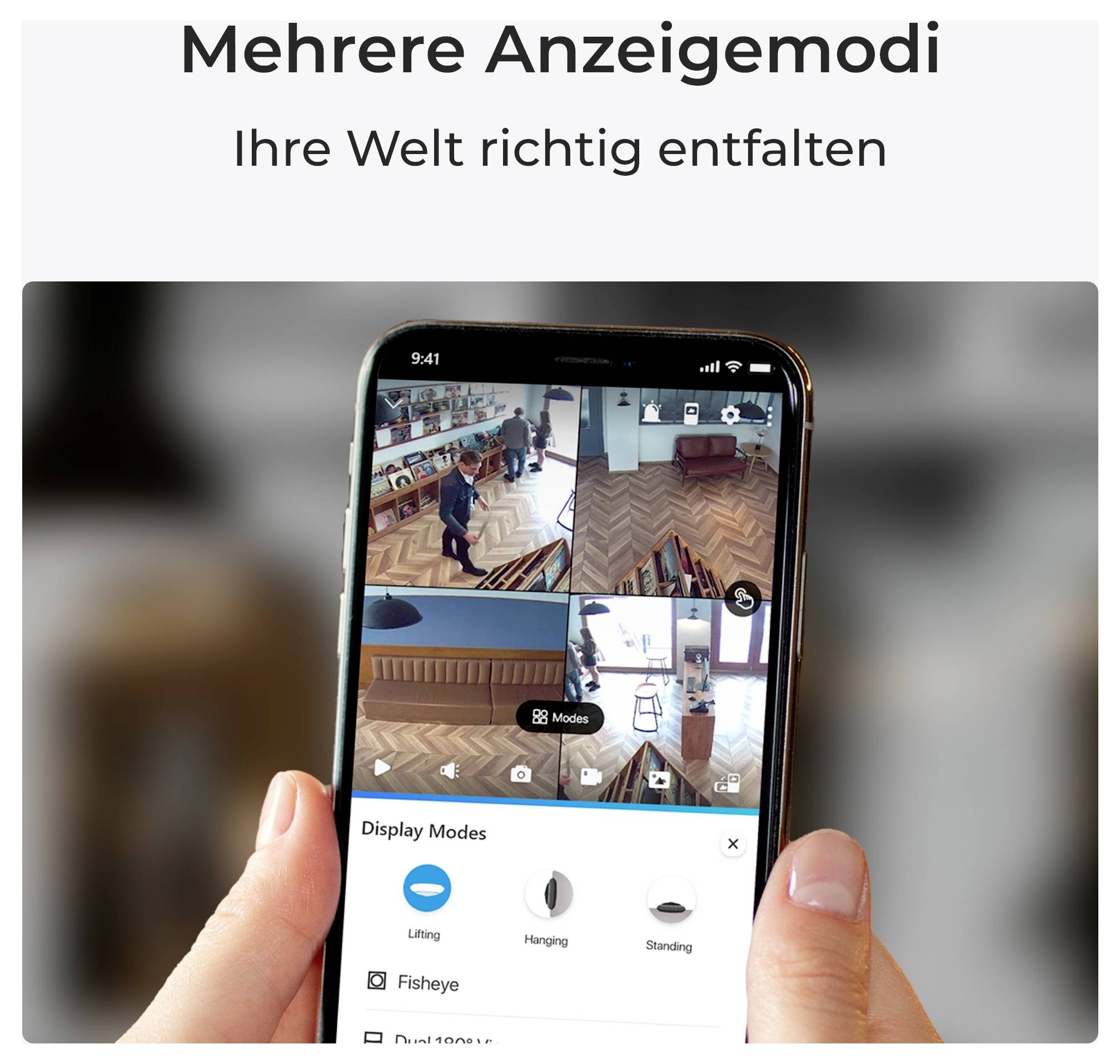 Eine Hand hält ein Smartphone, das verschiedene Sicherheitskamerawinkel in einem Raum zeigt. Text darüber liest sich: 'Mehrere Anzeigemodi Ihre Welt richtig entfalten.'