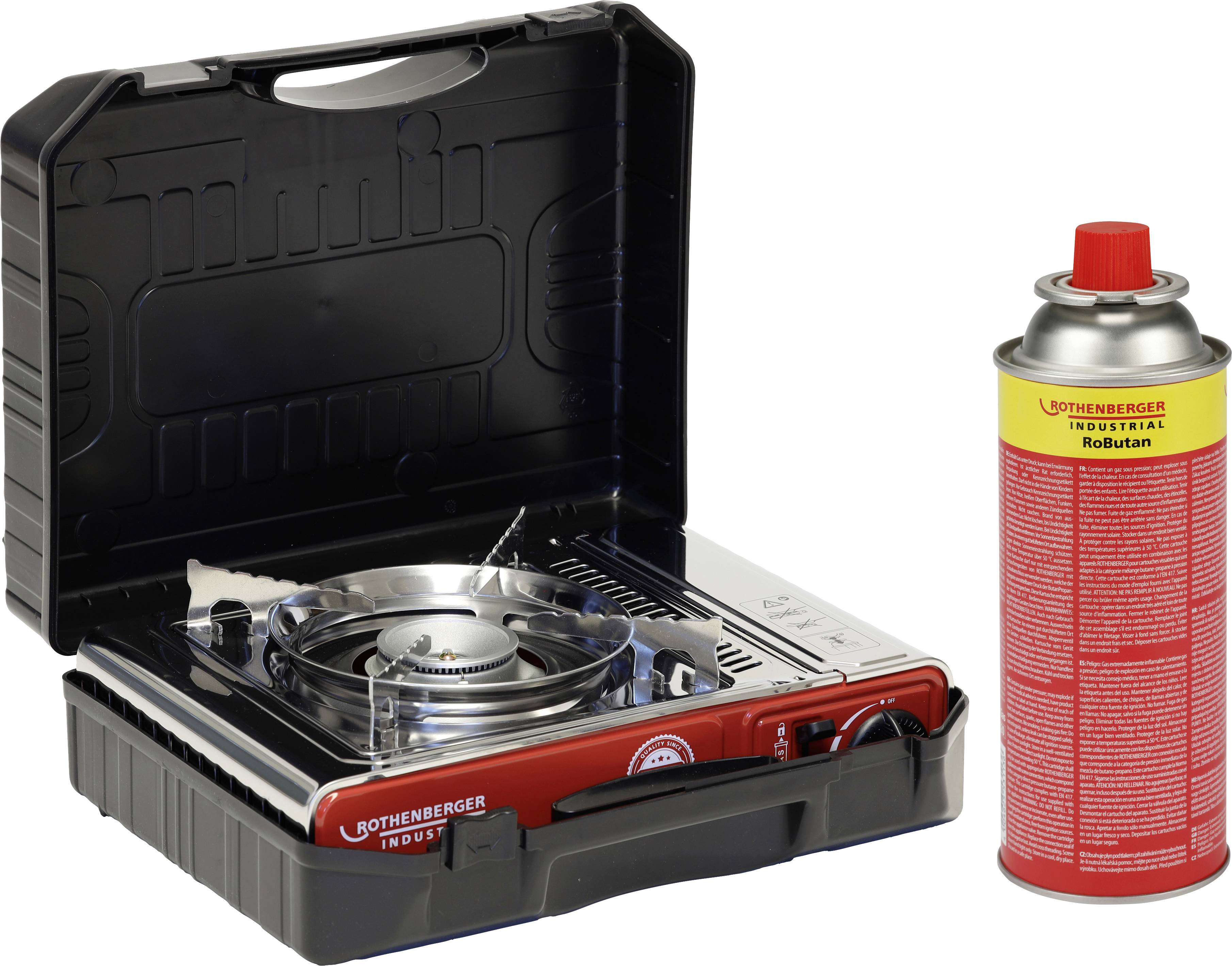 Ein tragbarer Gaskocher mit offenem Deckel neben einer roten Gaskartusche. Ideal für Camping oder Outdoor-Aktivitäten.