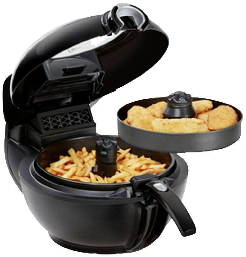 Eine Heißluftfritteuse mit geöffnetem Deckel, gefüllt mit Pommes frites und Hähnchennuggets in einem separaten Fach.