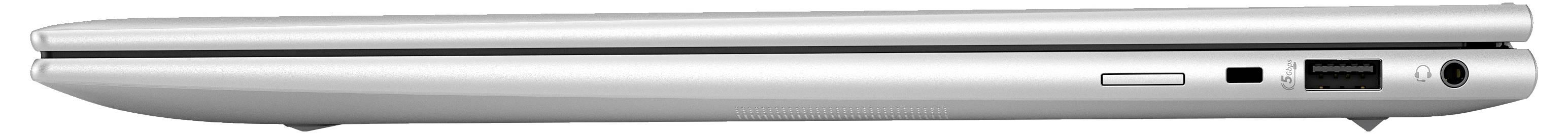 Ein geschlossenes Laptop, seitlich gezeigt, mit verschiedenen Anschlüssen und Lüftungsschlitzen auf der rechten Seite.