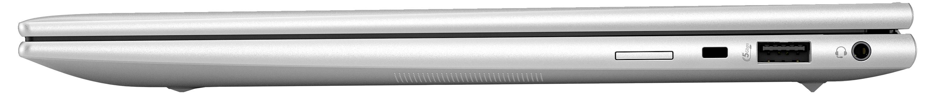 Ein silberner Laptop von der Seite, zeigt Anschlüsse für USB und Audio sowie den Lüftungsschlitz. Dünnes, modernes Design.