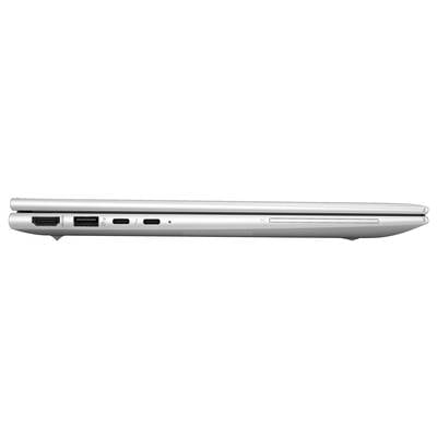 Ein geschlossenes silbernes Laptop von der Seite mit sichtbaren Anschlüssen und Laufwerk.