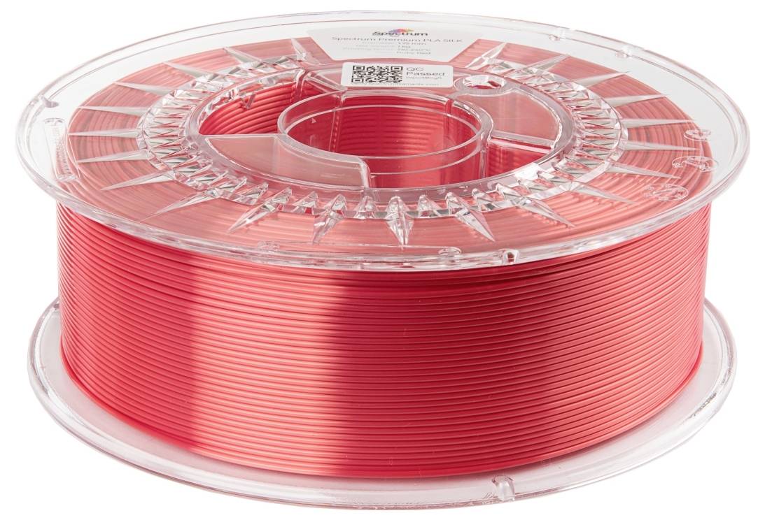 Rolle mit rotem 3D-Druckerfilament auf durchsichtiger Spule.