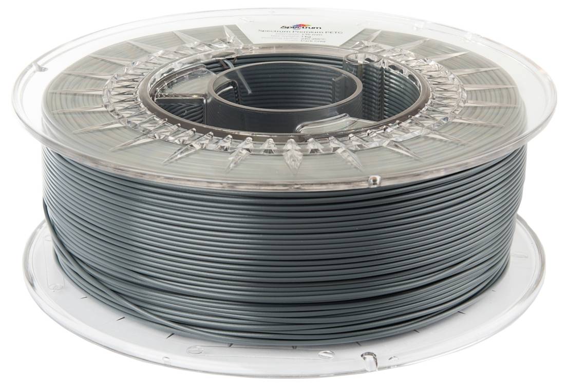 Eine durchsichtige, runde Plastikspule mit dunkelblauem 3D-Druckfilament, aufgerollt und bereit zur Verwendung in einem 3D-Drucker.