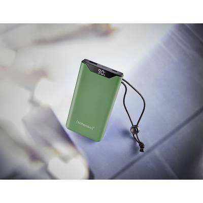 Eine grüne Powerbank mit digitaler Anzeige auf der Oberseite zeigt '90%' an. Sie hat eine schwarze Trageschlaufe.