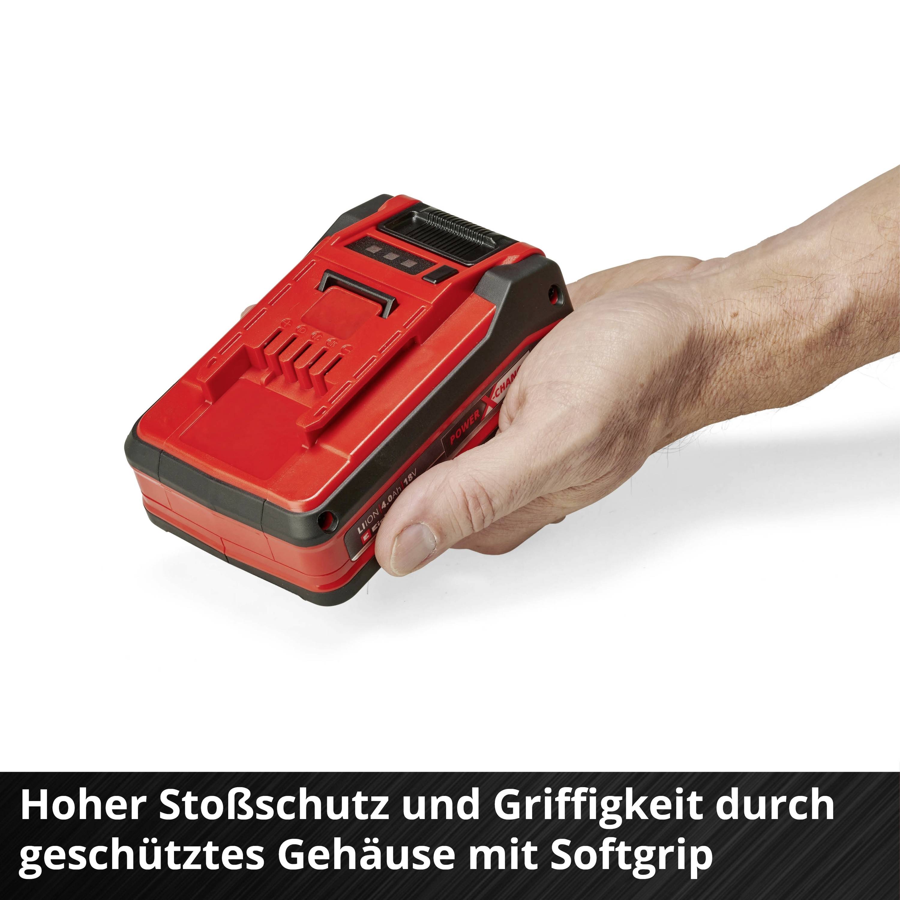 Eine Hand hält einen roten Akku mit Softgrip. Text: 'Hoher Stoßschutz und Griffigkeit durch geschütztes Gehäuse mit Softgrip'.