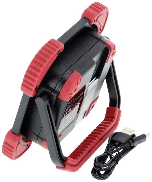 Eine tragbare Arbeitsleuchte mit rotem und schwarzem Design, zusammengeklappt. Daneben liegt ein USB-Ladekabel.