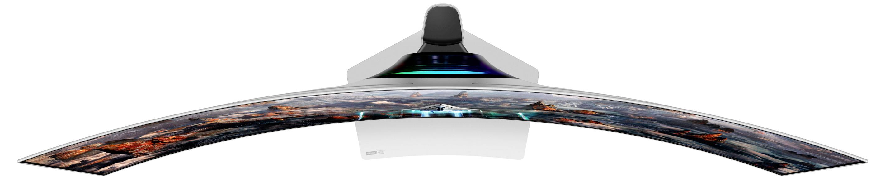 Ein ultrabreiter, gebogener Computermonitor von oben betrachtet, zeigt eine Landschaft auf dem Bildschirm.