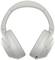 Kabellose, ohrumschließende Kopfhörer in Grau, ergonomisch gestaltet, mit integrierten Bedienelementen und Audiobuchse unten.