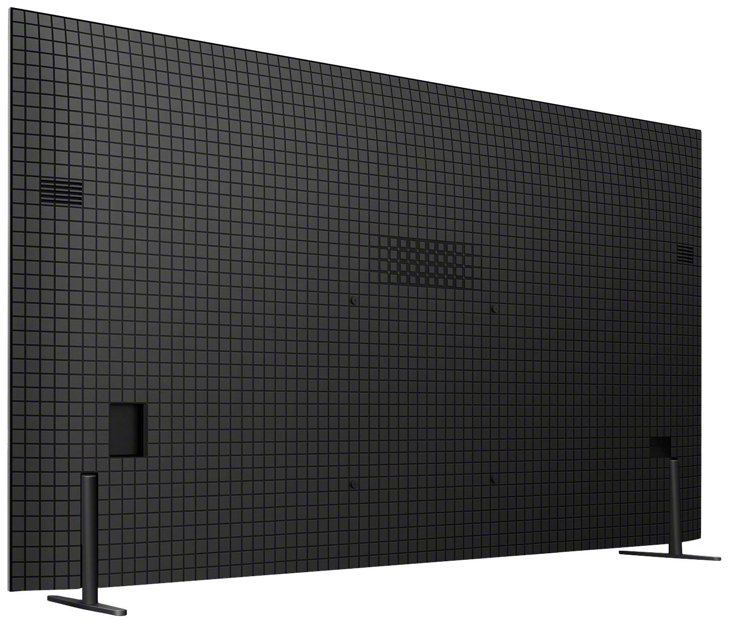 Das Bild zeigt die Rückseite eines großen rechteckigen Bildschirms auf Standfüßen. Die Oberfläche ist in einem rasterförmigen Muster gestaltet.