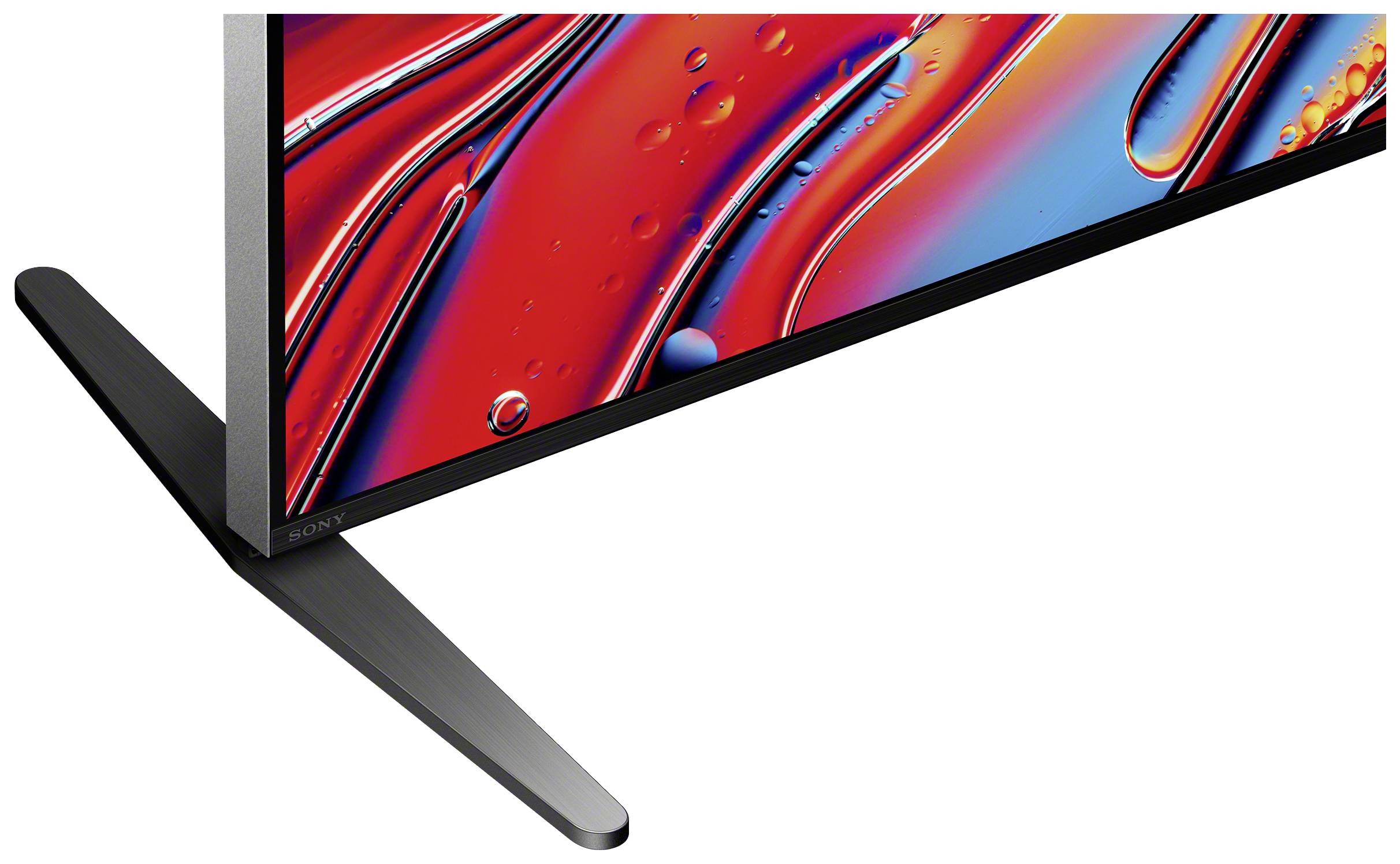 Ein Teil eines modernen Fernsehers mit schmalem Rahmen und futuristischem Design. Zu sehen ist der schmale Bildschirmrand und der Standfuß.