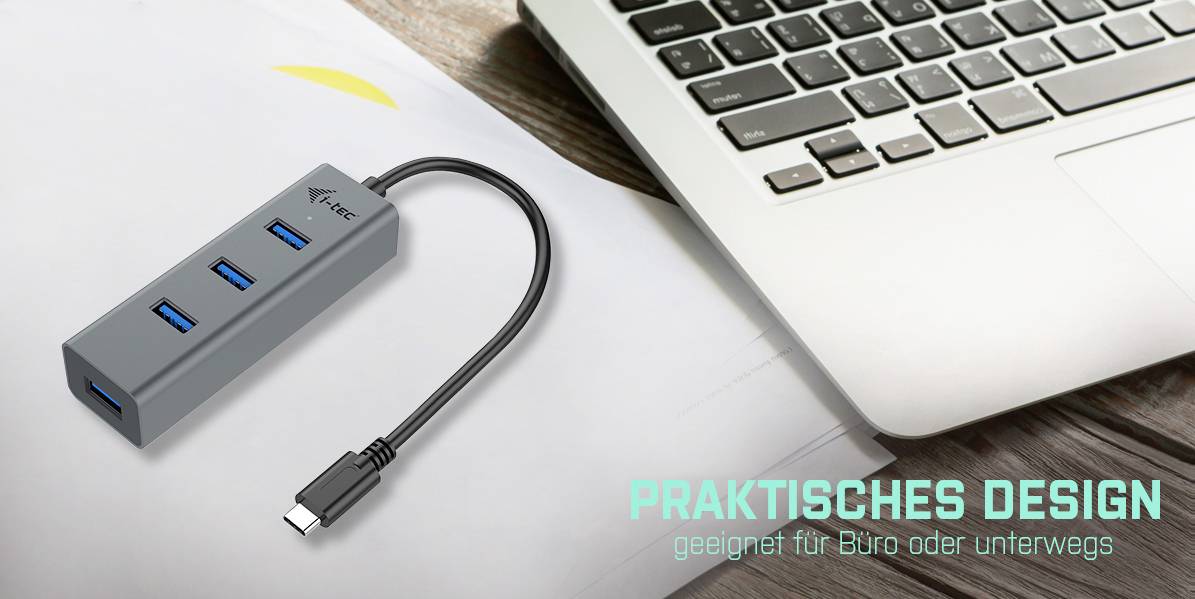 USB-Hub mit vier Anschlüssen neben einem Laptop auf einem Schreibtisch. Text: 'Praktisches Design geeignet für Büro oder unterwegs'.
