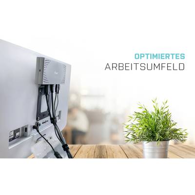 'Optimiertes Arbeitsumfeld': Monitor auf Schreibtisch mit Kabelmanagement, daneben ein grüner Pflanzentopf. Fokus auf Ordnung und Effizienz.