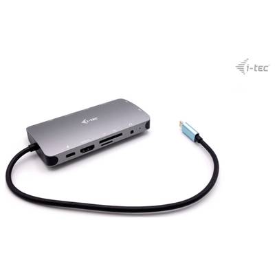 Ein grauer USB-C-Hub von i-tec mit mehreren Anschlüssen, darunter HDMI, USB und Kartenleser. Ein blaues USB-C-Kabel ist angeschlossen.