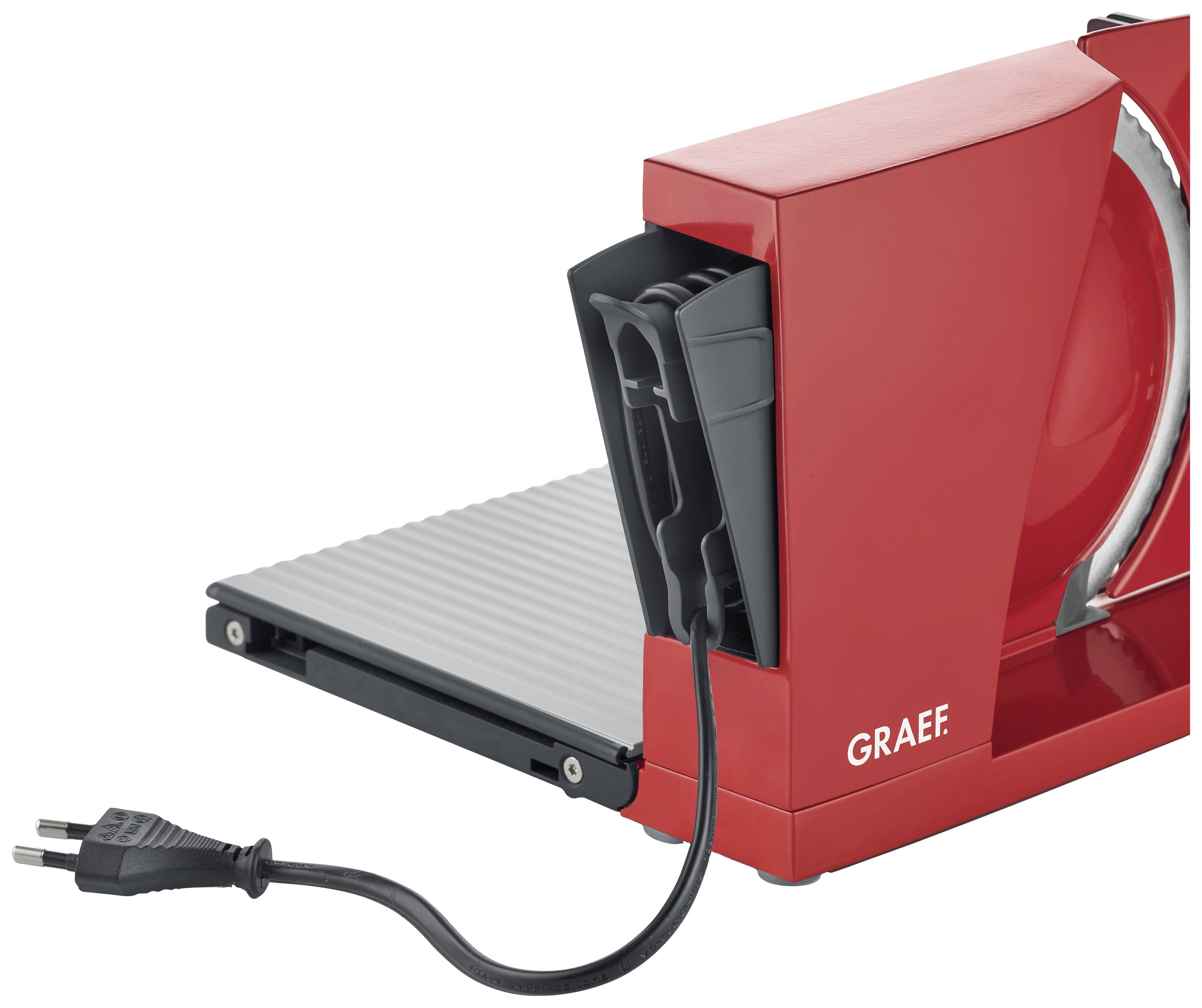 Rote elektrische Allesschneider-Maschine mit angeschlossenem Stromkabel, auf einem grauen Sockel montiert.