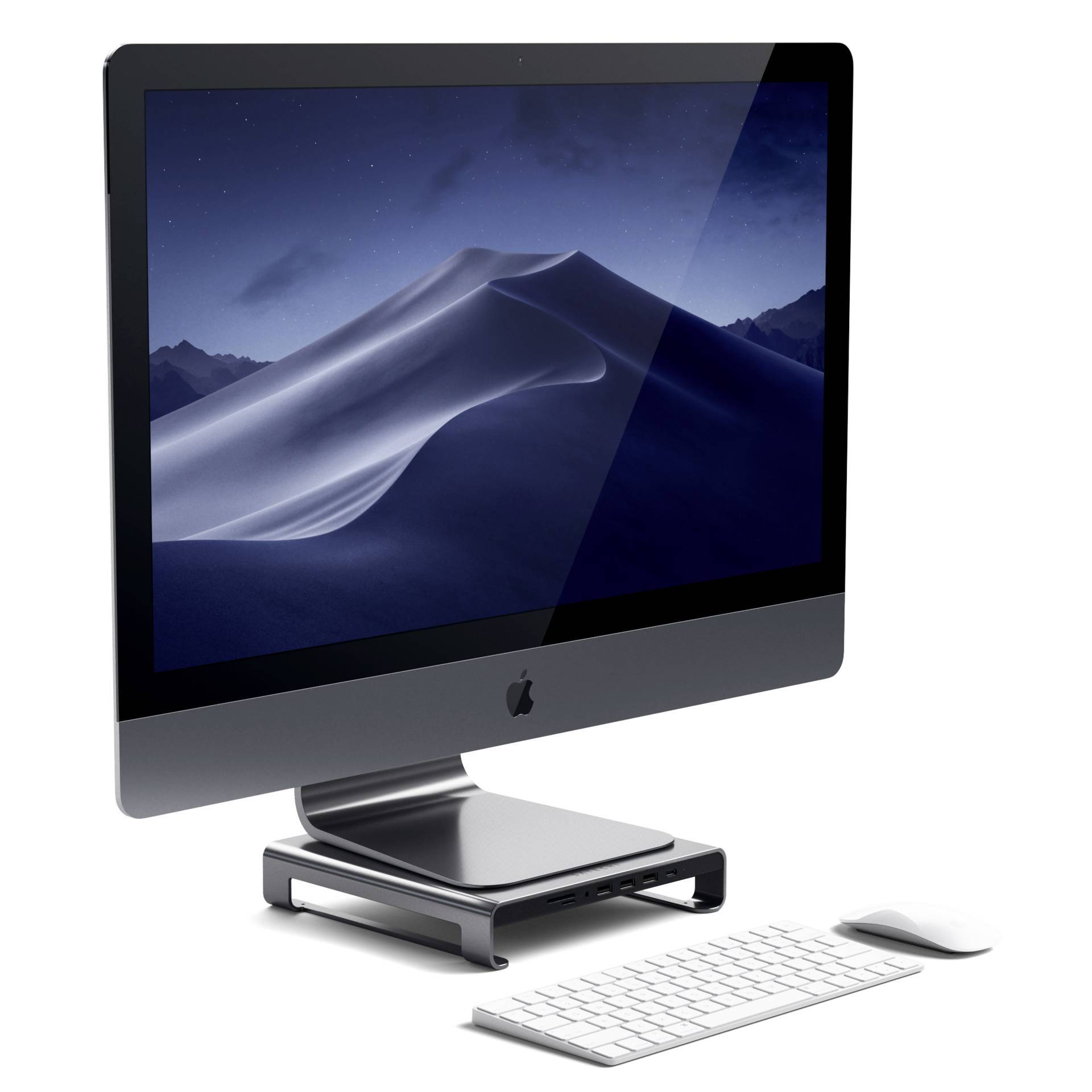 Ein All-in-One-Desktop-Computer mit einem großen Bildschirm, kabelloser Tastatur und Maus. Der Bildschirm zeigt eine nächtliche Wüstenlandschaft.