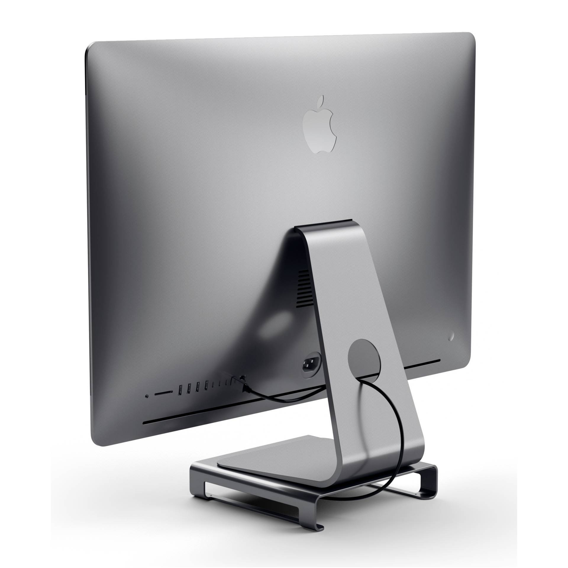 Ein grauer iMac-Desktop-Computer steht auf einem Tisch und zeigt seine Rückseite. Ein Stromkabel ist am Gerät angeschlossen.