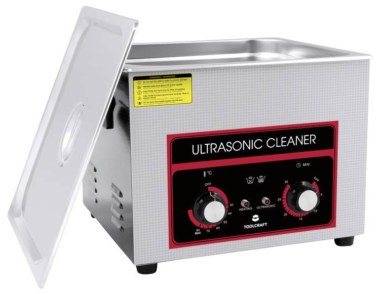 'Ultrasonic Cleaner' Gerät mit offenem Deckel, verwendet für präzise Reinigung durch Ultraschallwellen. Bedienknöpfe vorne sichtbar.