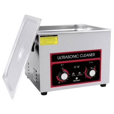 'Ultrasonic Cleaner' Gerät mit offenem Deckel, verwendet für präzise Reinigung durch Ultraschallwellen. Bedienknöpfe vorne sichtbar.