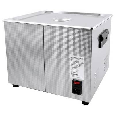 Metallischer Ultraschallreiniger mit seitlichem Griff und Netzschalter. Ein Aufkleber zeigt technische Spezifikationen und Sicherheitszeichen.
