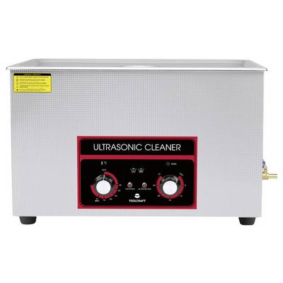 Ultraschallreiniger aus Metall mit Bedienfeld. Zwei Drehknöpfe für Timer und Temperatur. Etikett mit Bedienhinweisen oben links.