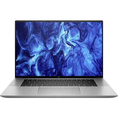 Ein Laptop mit einem blauen, abstrakten Hintergrundbild auf dem Bildschirm. Der Laptop ist silberfarben und hat eine Tastatur.