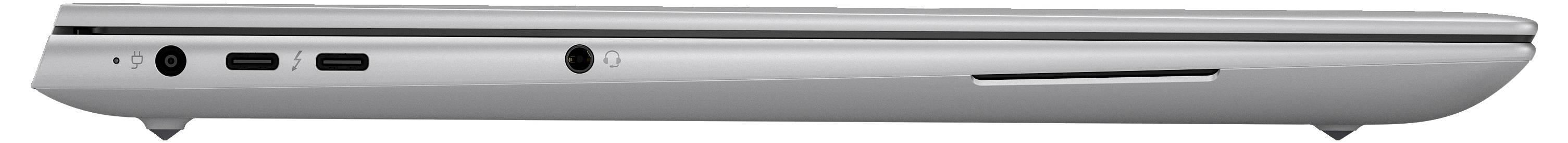 Ein geschlossenes, silbernes Laptop von der Seite, mit mehreren Anschlüssen wie USB-C und Kopfhörerbuchse auf der linken Seite.