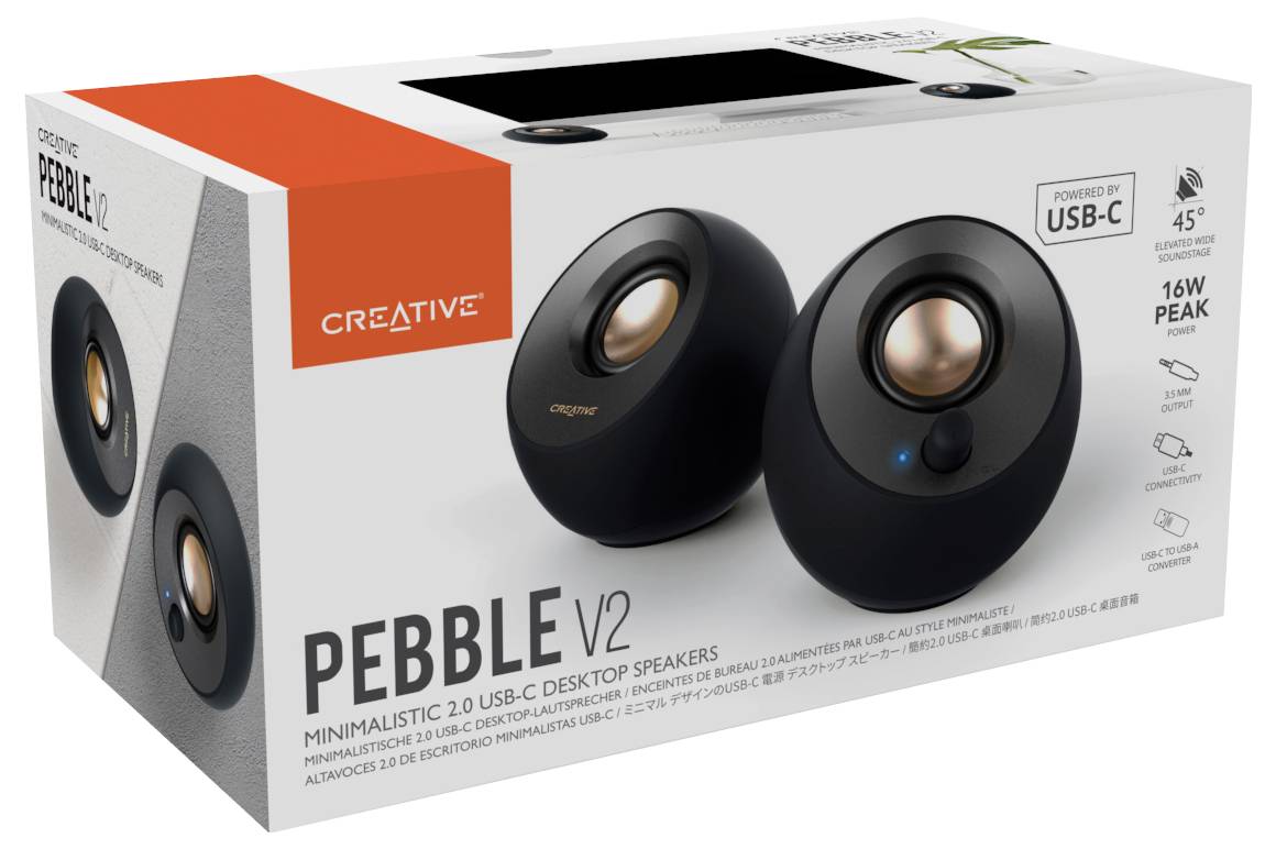 Schachtel mit schwarzen Creative Pebble V2 USB-C Desktop-Lautsprechern, minimalistisch, 16W Peak-Leistung, im Vordergrund abgebildet.