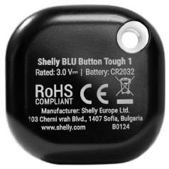 Ein schwarzer Shelly BLU Button Tough 1 mit technischen Informationen auf der Rückseite, einschließlich Batterietyp CR2032.