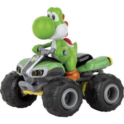Eine grüne Dinosaurierfigur auf einem Spielzeug-Quad mit großen Rädern, sitzt auf einem grünen Fahrzeug.