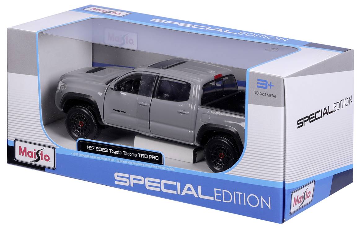 Spielzeugmodell eines grauen 2023 Toyota Tacoma TRD Pro in einer Schachtel von Maisto, bezeichnet als 'Spezialausgabe'.