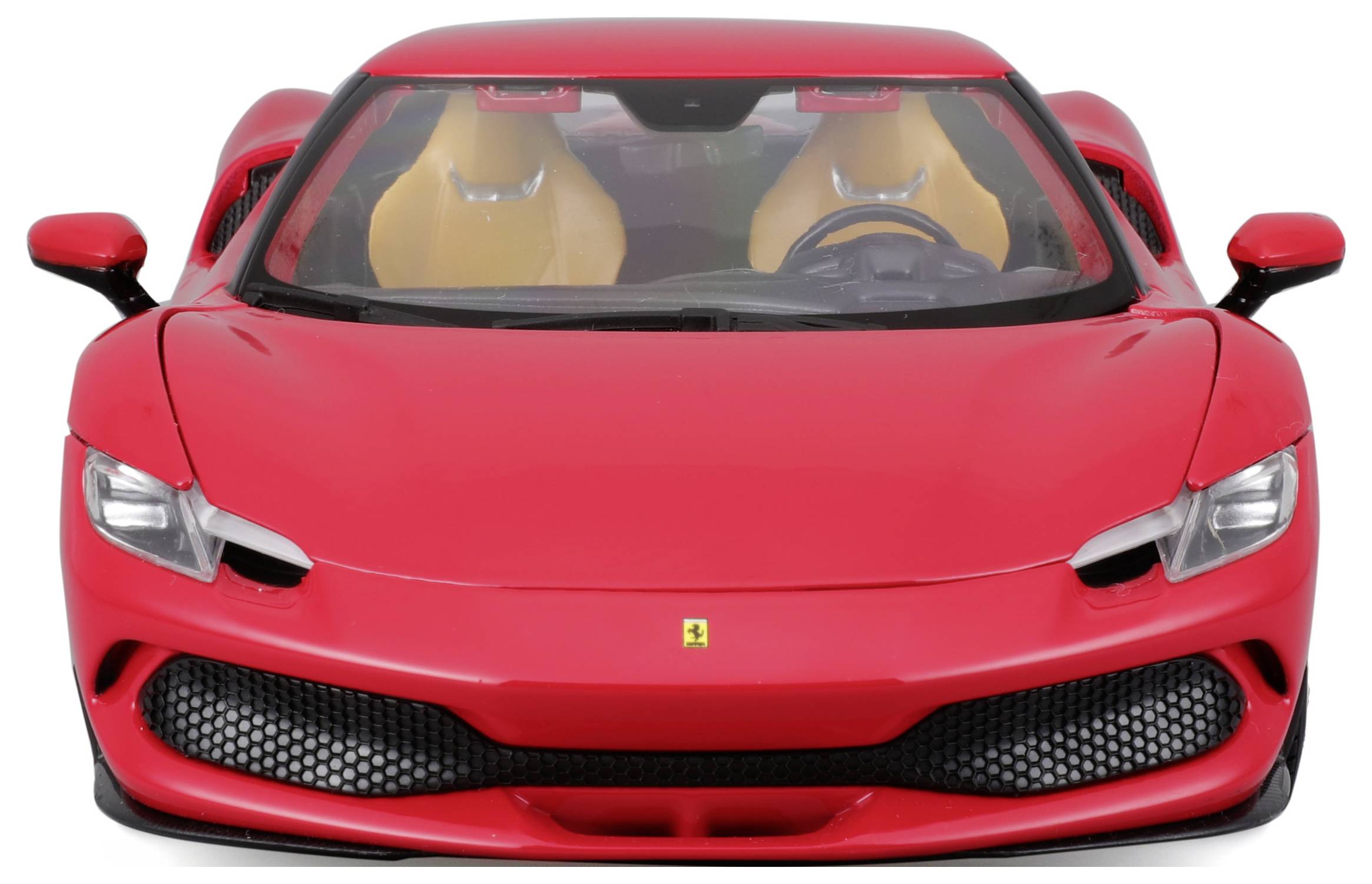 Ein rotes Sportauto von vorne, mit markantem, aerodynamischem Design und gelben Sitzen.