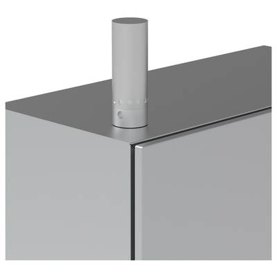 Ein grauer Metallzylinder ist oben auf einem flachen, eckigen Metallkasten montiert.