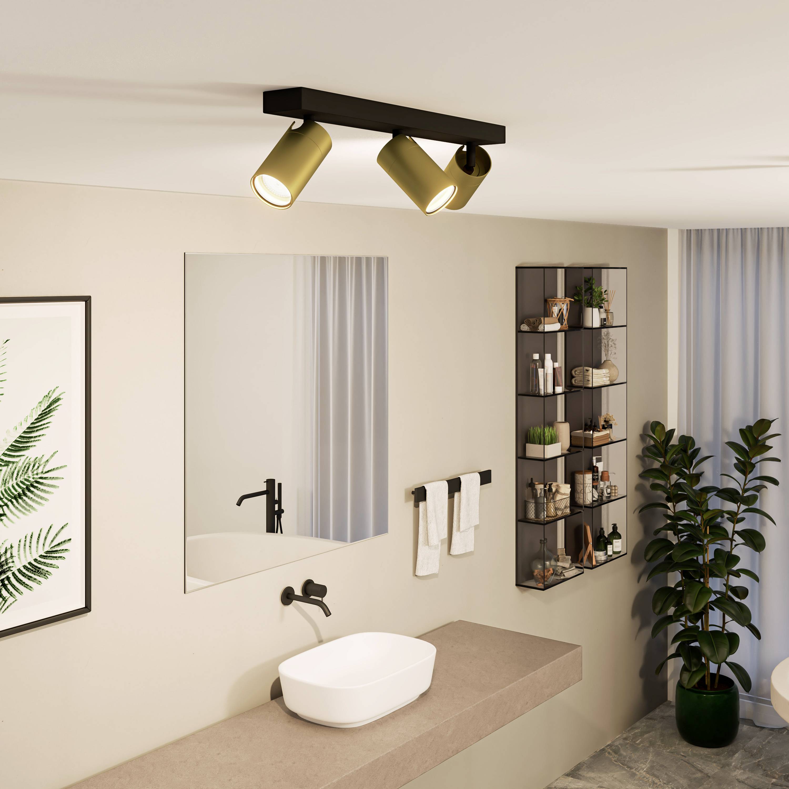Ein modernes Badezimmer mit Waschbecken, Handtücher, Spiegel und Regale für Toilettenartikel. Dezente Beleuchtung und Pflanzenakzente.