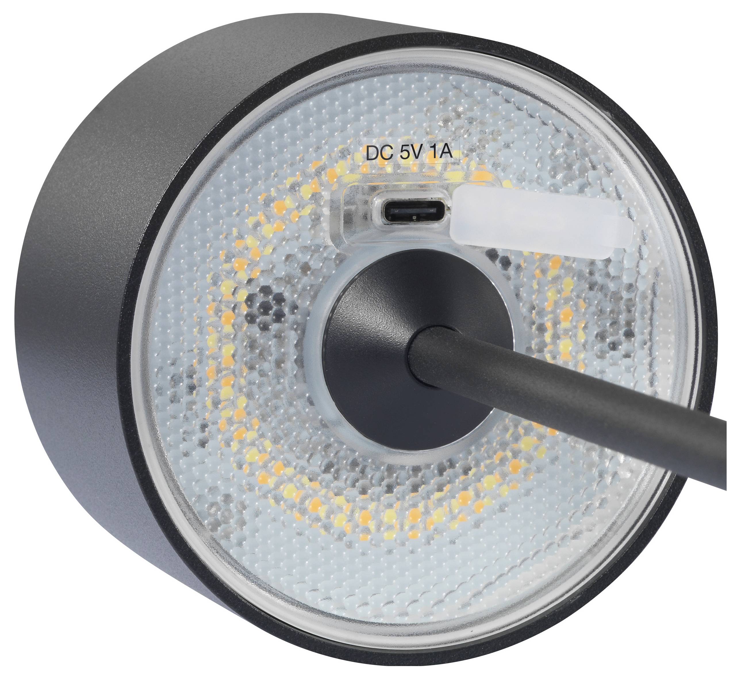 Nahaufnahme eines runden, leuchtenden LED-Lichts mit schwarzem Kabel und Stromanschluss mit Aufschrift 'DC 5V 1A' im Inneren.